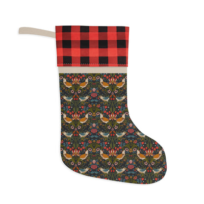 A Christmas stocking with a plaid pattern on the cuff and a print of birds on a dark background, with a hanging loop at the top.