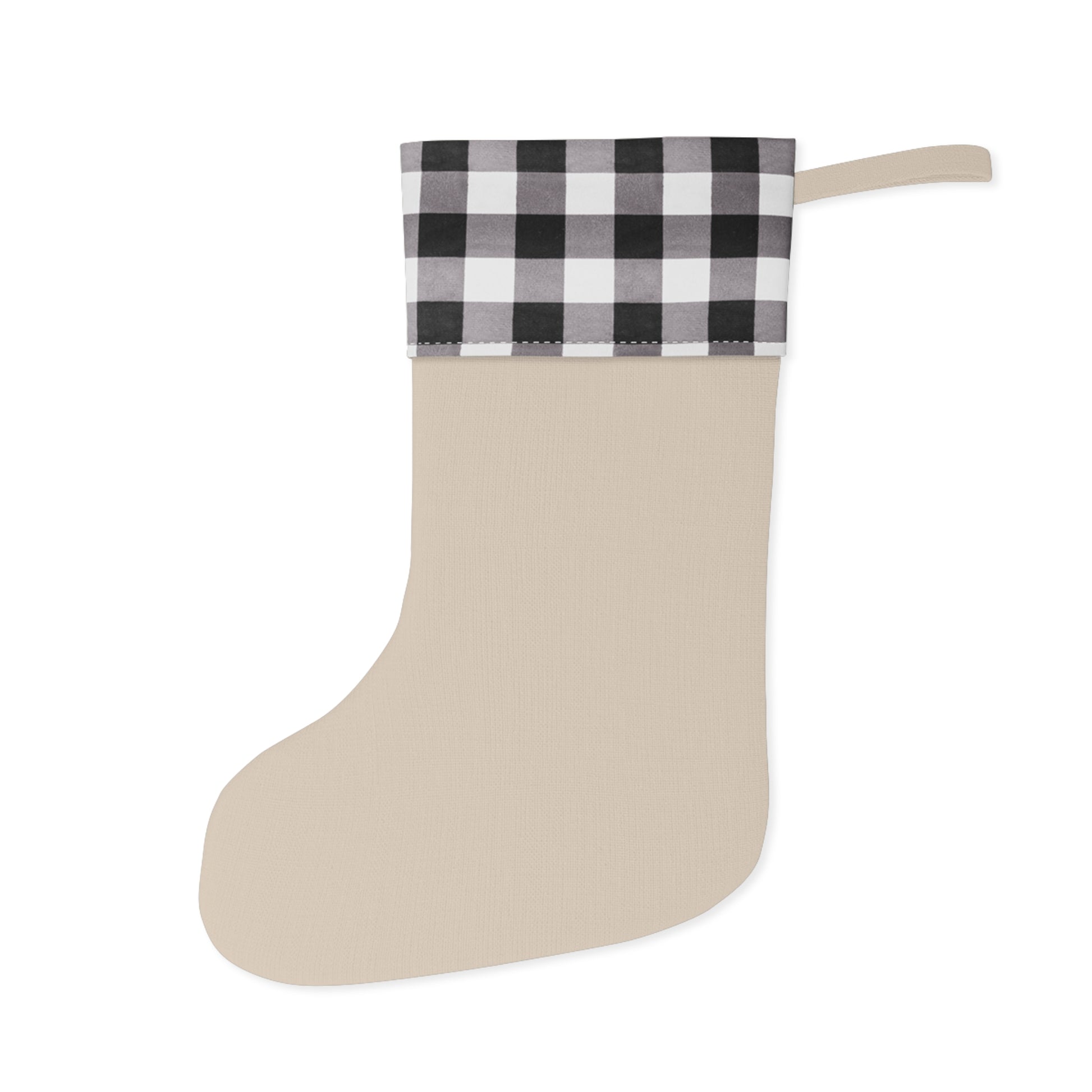 Beige Christmas stocking with black and white checkered top on a white background