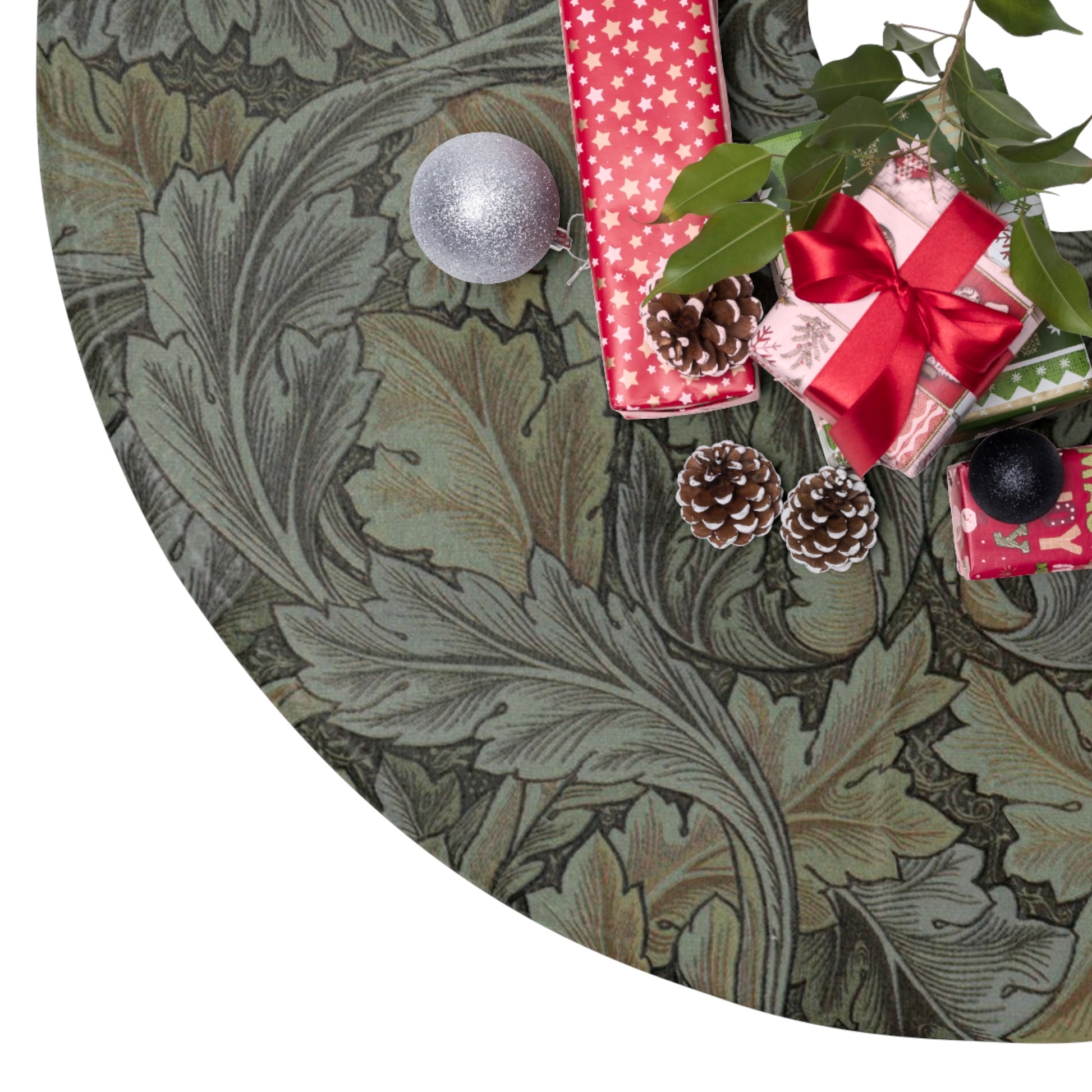 Decorative wreath with Christmas presents and ornaments on a green leafy background