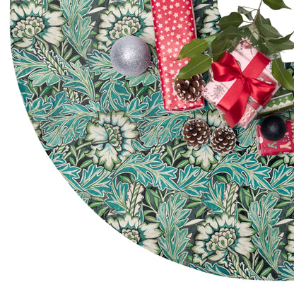 Decorative green leaf-patterned tree skirt with Christmas decorations on a white background