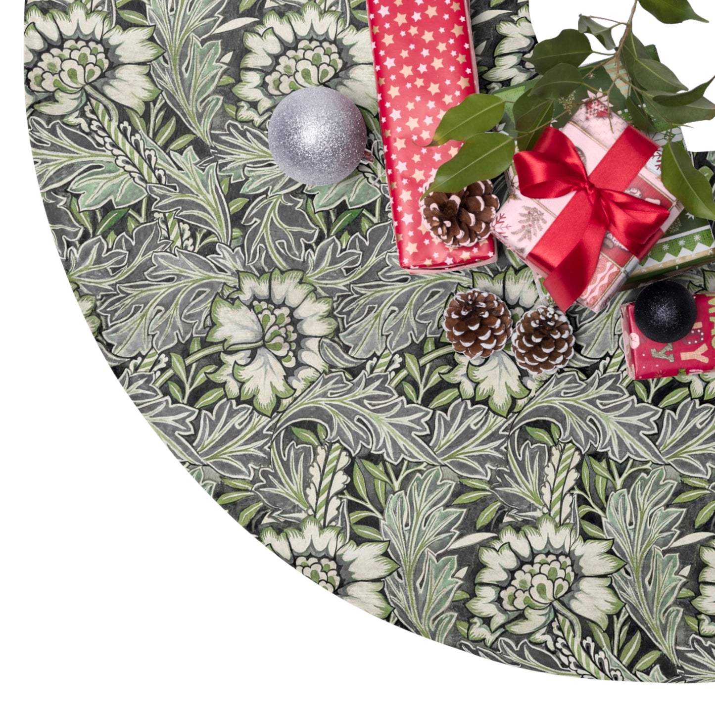Decorative green leaf-patterned tree skirt with Christmas decorations on a white background