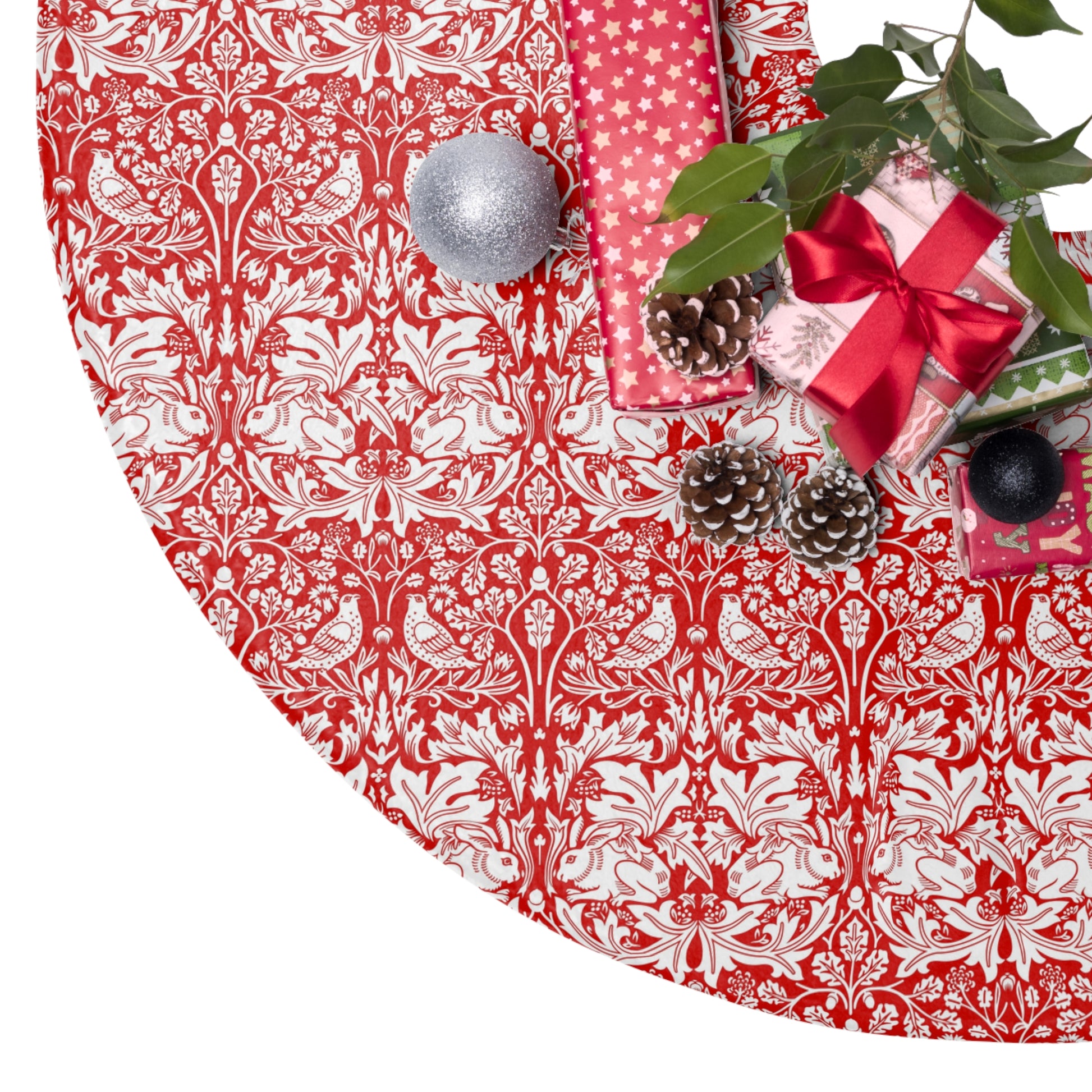 Decorative red and white patterned tablecloth with Christmas decorations on a white background