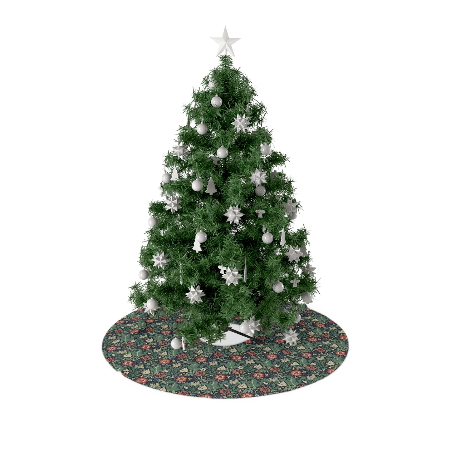 A round Christmas tree skirt with a floral design on a green background, placed under a Christmas tree with a star at the top.