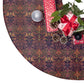 Decorative Christmas tree skirt with presents and ornaments on a white background