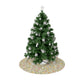 Decorated Christmas tree with white ornaments on a floral-patterned base against a white background