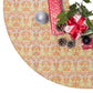 Decorative Christmas tree skirt with pattern, surrounded by gift boxes and ornaments on a white background.