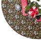 Decorative Christmas tree skirt with a pattern of ghosts, trees, and presents.