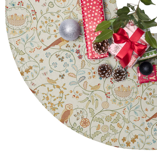 Decorative Christmas tree skirt with floral pattern, presents, and ornaments on a white background