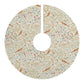 Decorative tree skirt with floral and bird pattern on a white background