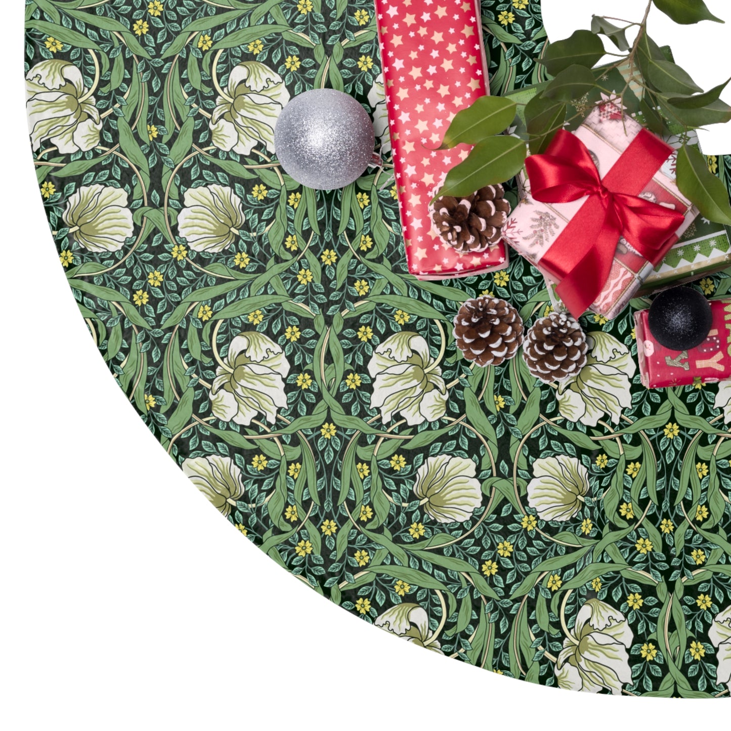 Decorative green fabric with floral pattern, pinecones, and Christmas ornaments on a white background