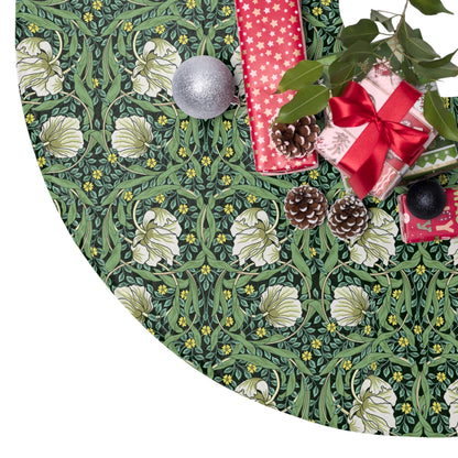 Decorative green fabric with floral pattern, pinecones, and Christmas ornaments on a white background