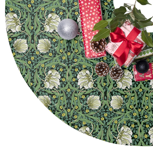 Decorative green fabric with floral pattern, pinecones, and Christmas ornaments on a white background