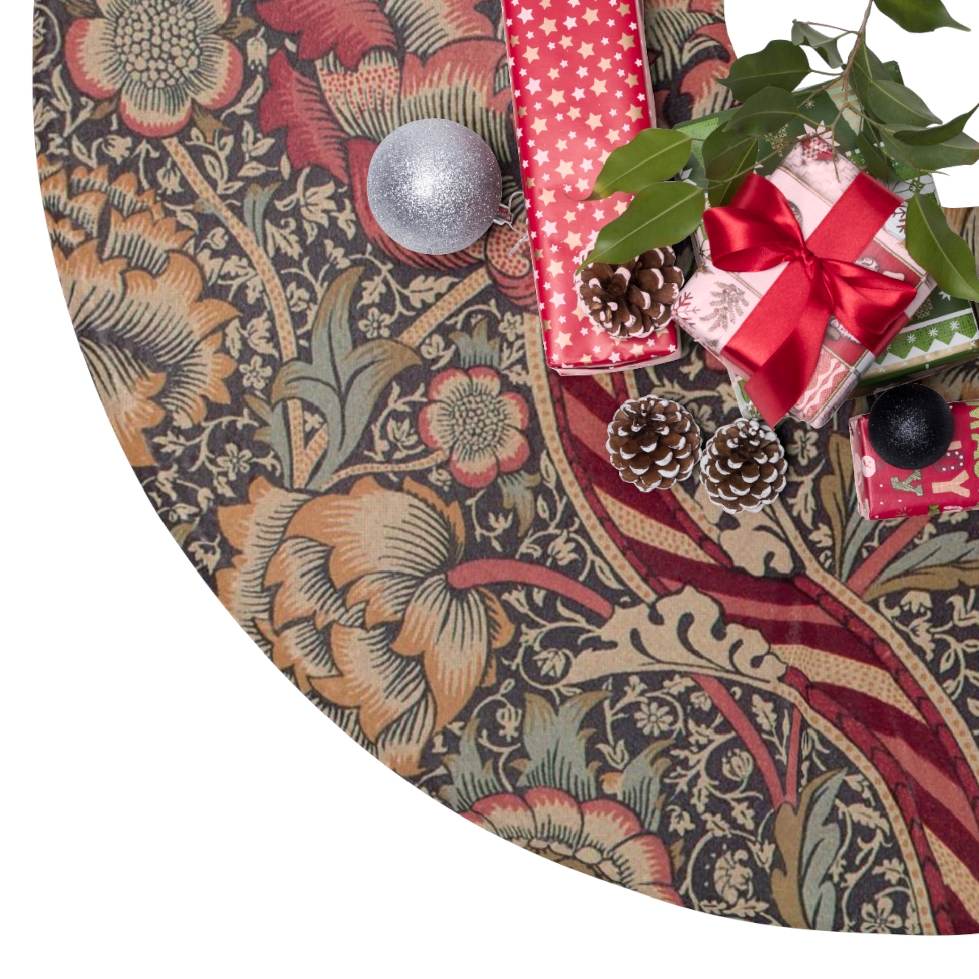 Decorative Christmas tree skirt with floral pattern and holiday items on a white background