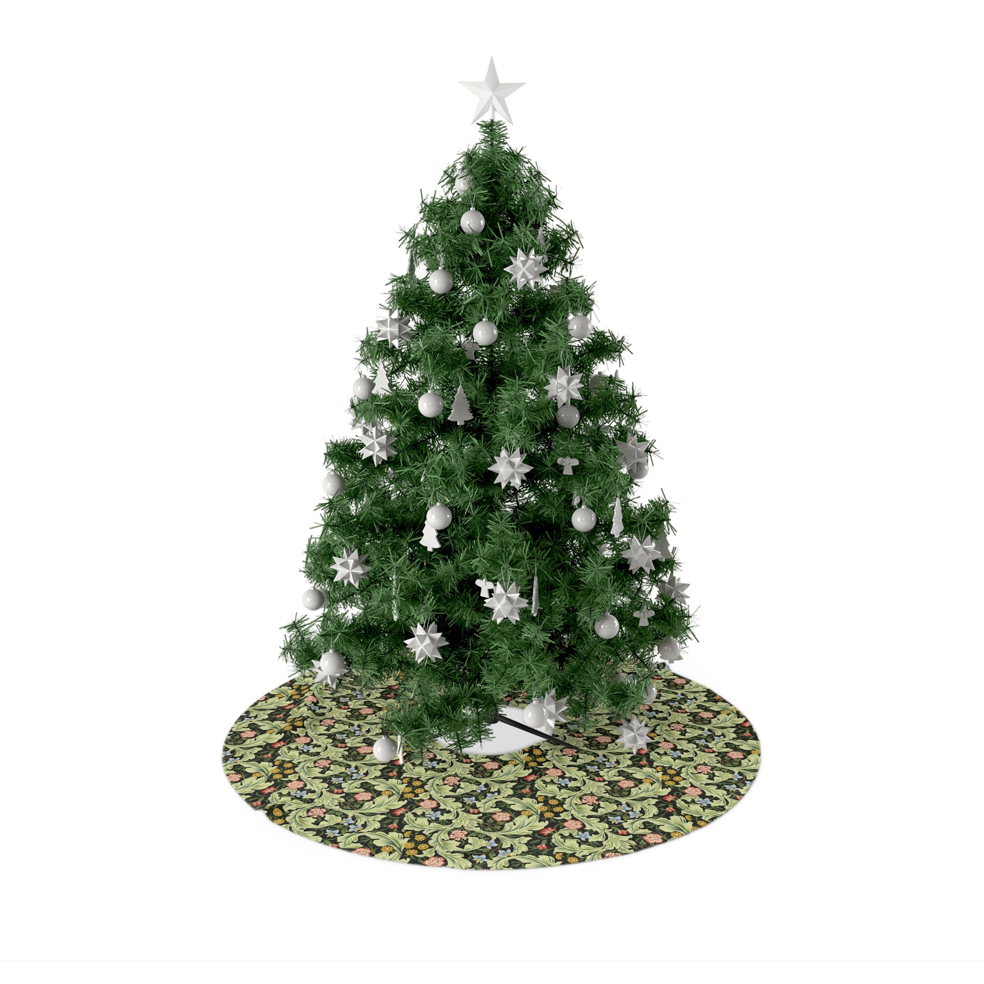 A green Christmas tree skirt with a floral pattern, placed under a artificial Christmas tree with a star at the top.