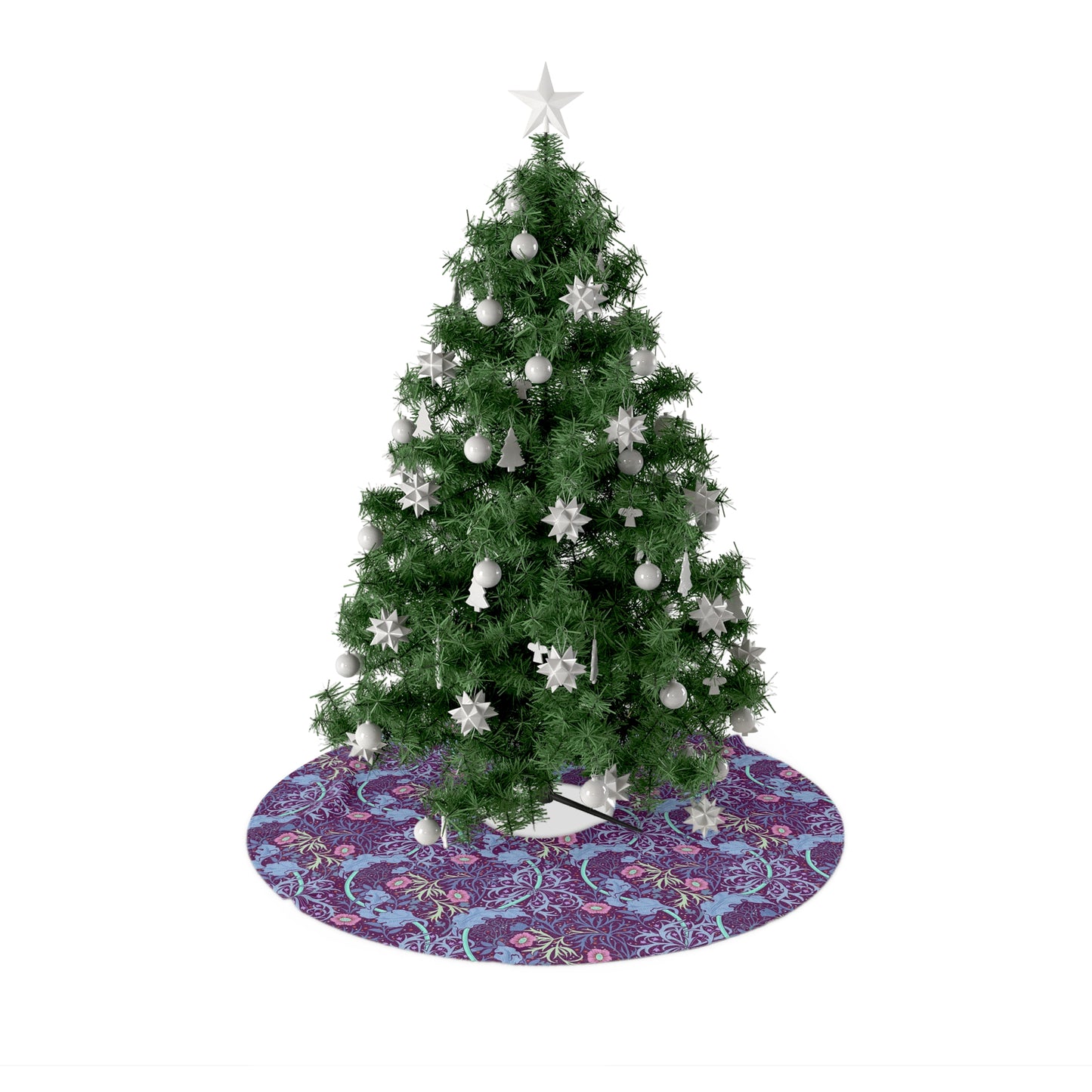 A Christmas tree skirt with a pink floral pattern based on the William Morris Seaweed Collection, displayed around the base of a Christmas tree.