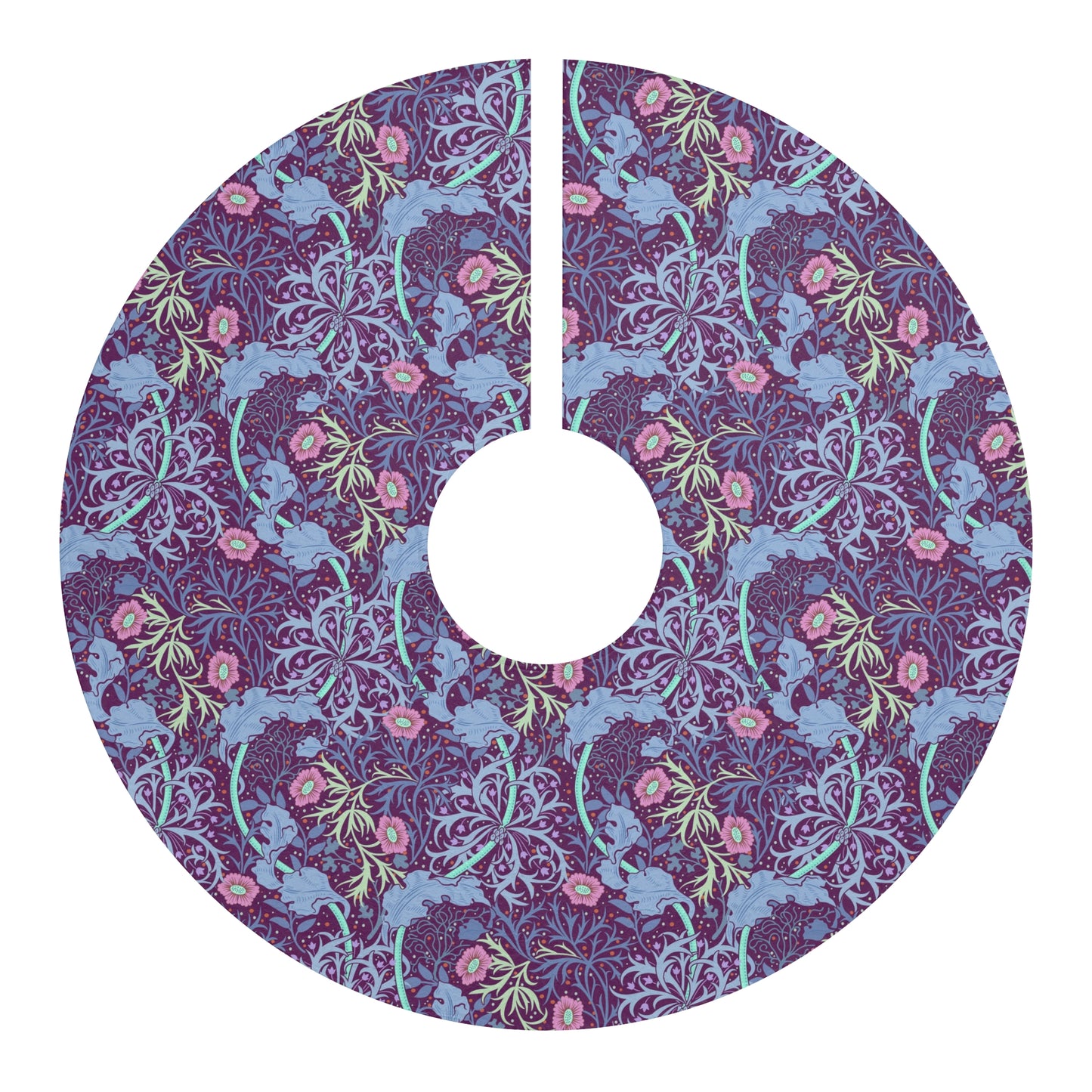 A Christmas tree skirt with a pink floral pattern based on the William Morris Seaweed Collection, displayed around the base of a Christmas tree.