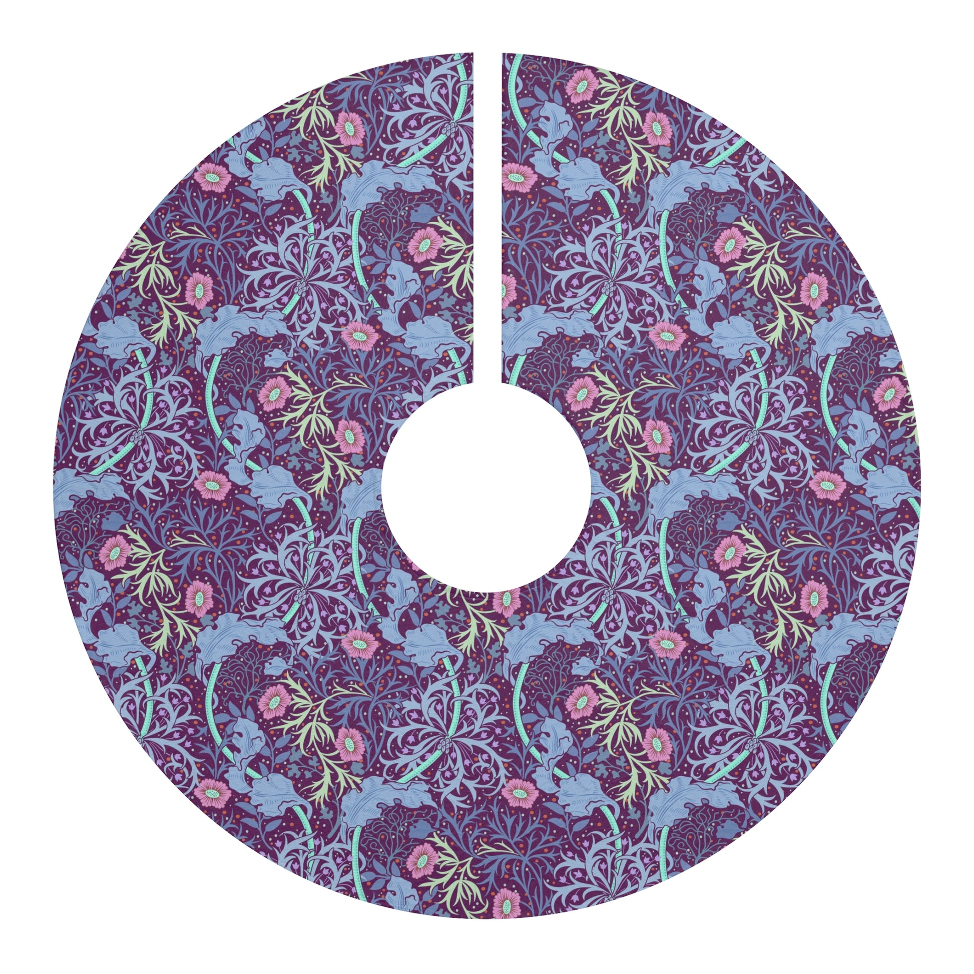 A Christmas tree skirt with a pink floral pattern based on the William Morris Seaweed Collection, displayed around the base of a Christmas tree.