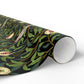Roll of decorative paper with nature-themed design on a white background