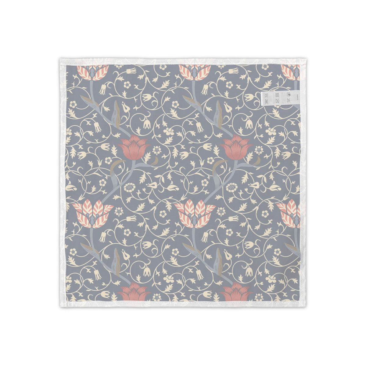 A square fabric item, likely a napkin or pocket square, featuring a classic William Morris-style floral and vine pattern in muted gray, dusty pink, and cream, finished with a white border.
