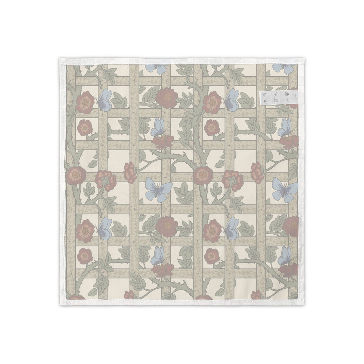 A square textile product, likely a napkin or small towel, featuring a vintage-style floral trellis pattern on a cream background with a white stitched border.