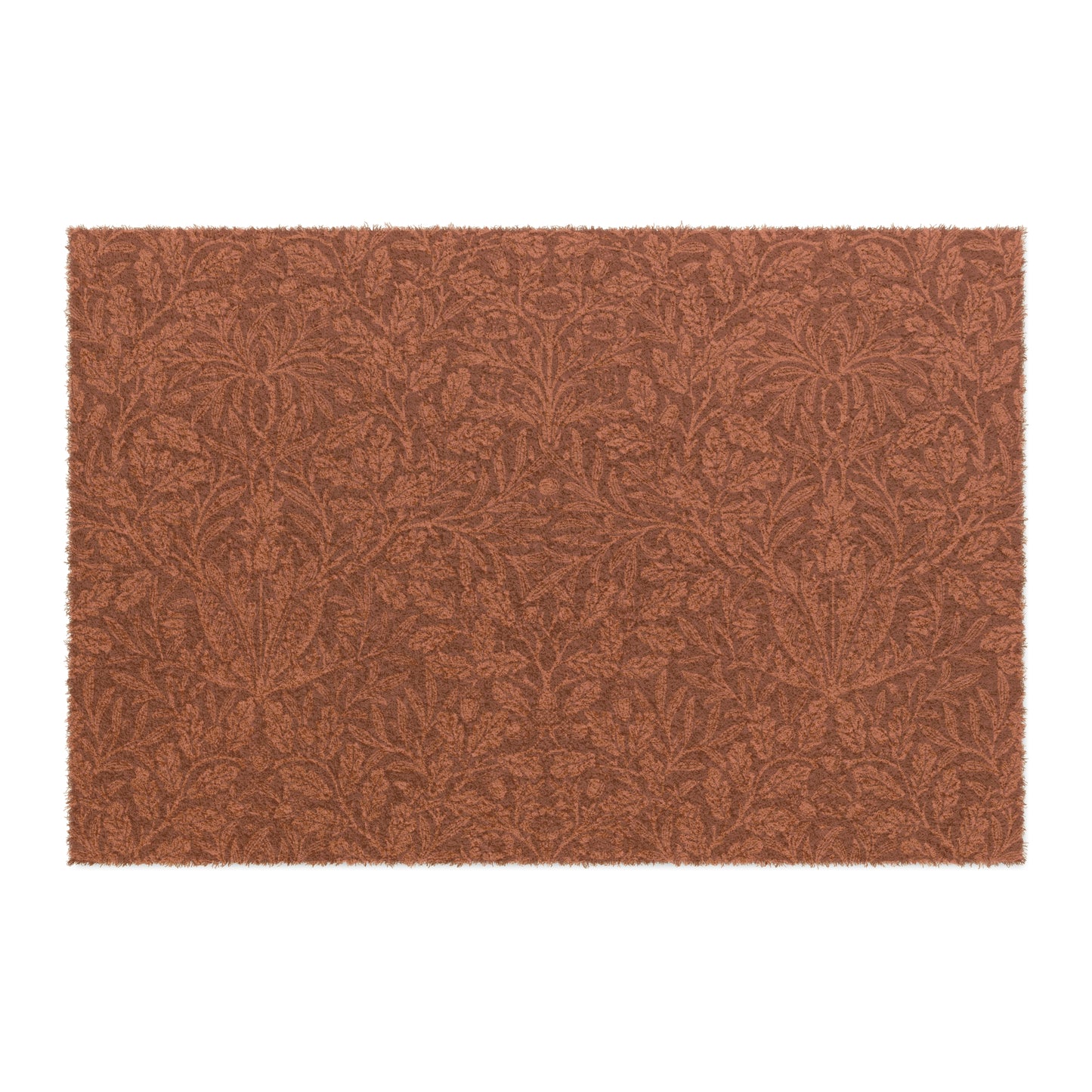 A rectangular coconut coir doormat with an intricate floral William Morris & Co pattern in a rust colour, mainly for outdoor use.