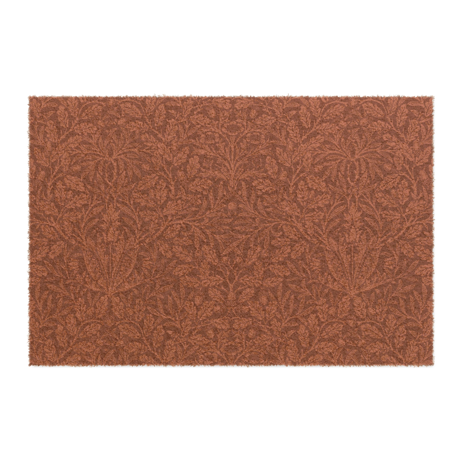 A rectangular coconut coir doormat with an intricate floral William Morris & Co pattern in a rust colour, mainly for outdoor use.