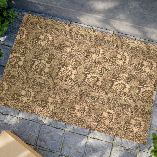 A rectangular area rug with a classic William Morris-style floral pattern in beige, brown, and muted green, laid out on a gray stone paver surface.