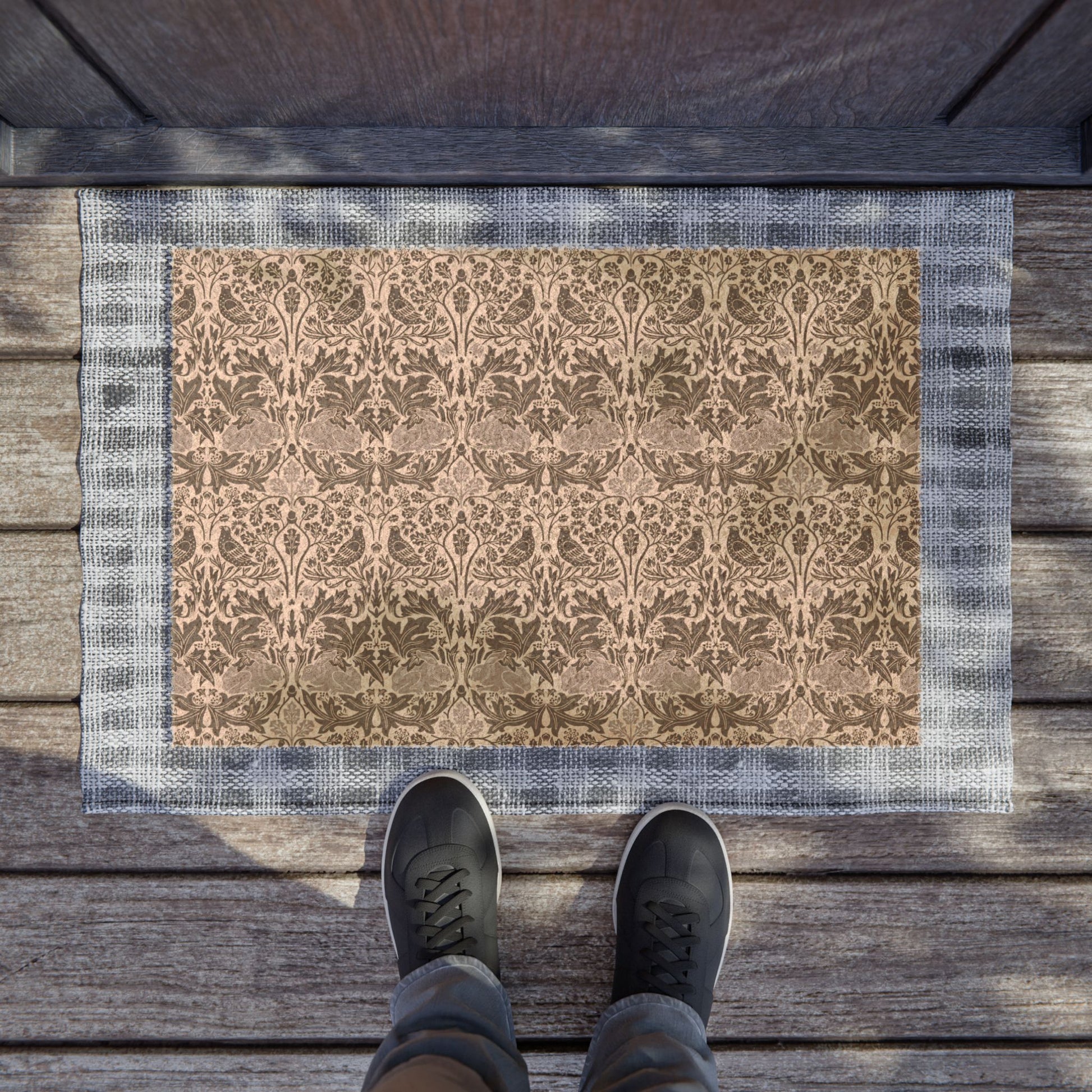 Patterned coconut coir hard wearing door mat with intricate floral and rabbit design from William Morris & Co 