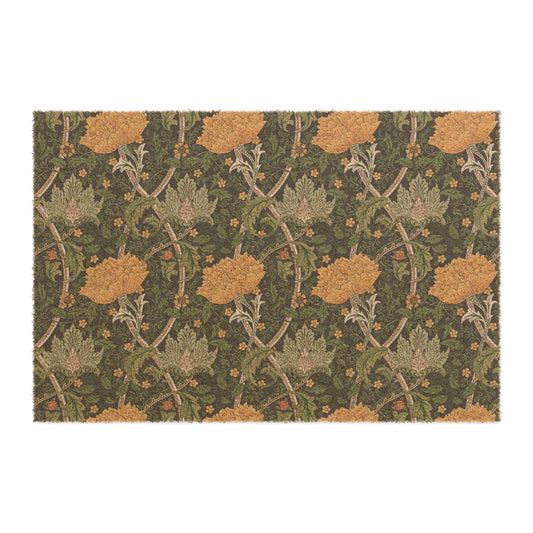 A rectangular coconut coir doormat with an intricate floral pattern inspired by William Morris, featuring a mix of green, brown, and yellow colours.