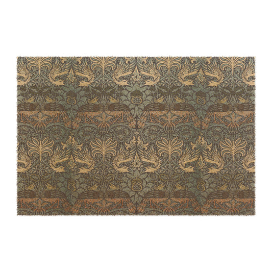 A rectangular coconut coir doormat with an intricate peacock and dragon pattern in shades of blue and brown .rom William Morris & Co