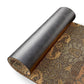 Roll of patterned wallpaper with a decorative design on a white background