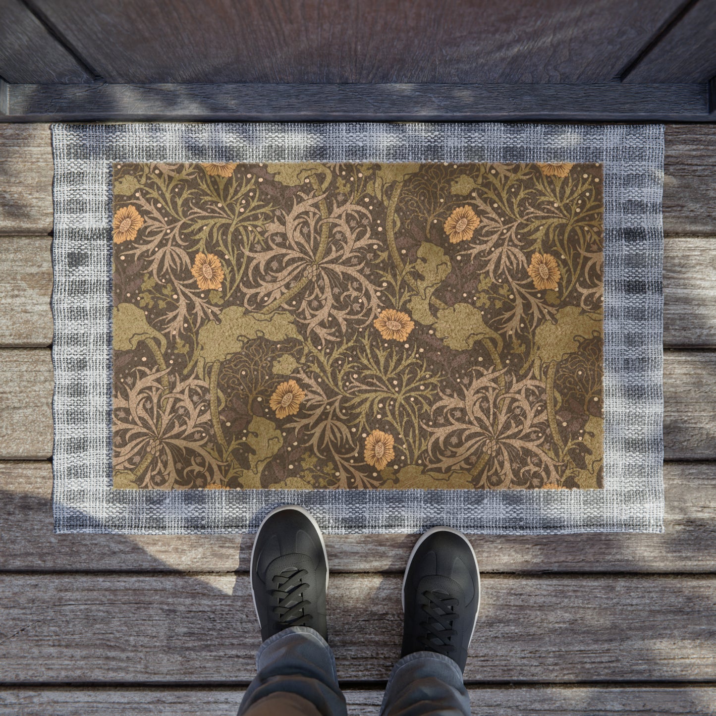 Rectangular doormat with a floral pattern in yellow and green floral shades by William Morris & Co, featuring a vinyl backing.