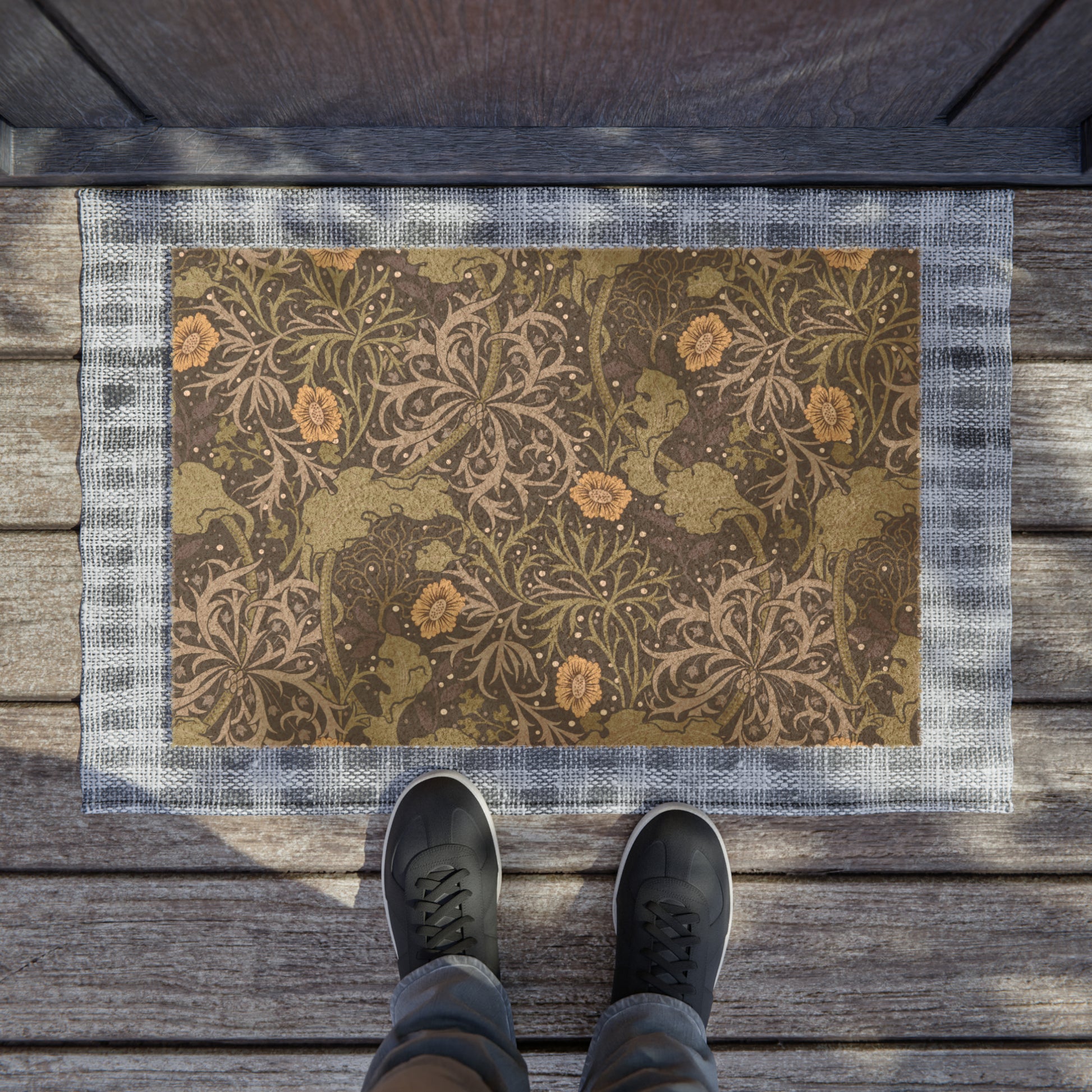 Rectangular doormat with a floral pattern in yellow and green floral shades by William Morris & Co, featuring a vinyl backing.