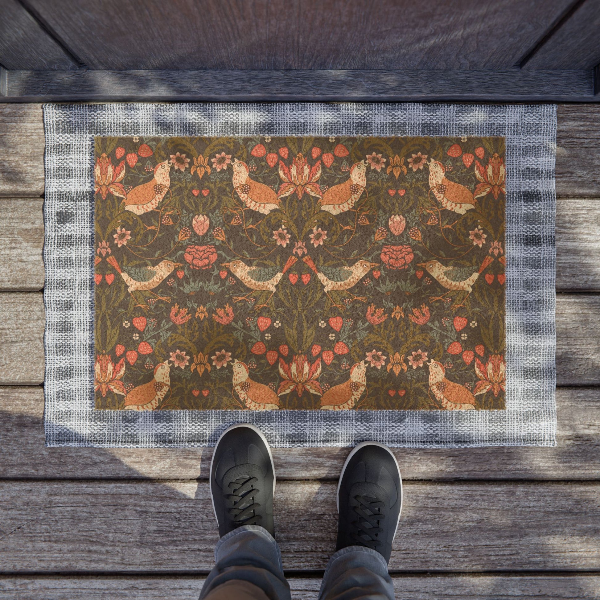 Decorative doormat with floral and chicken pattern on wooden floor.