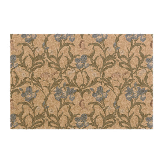 A rectangular coconut coir doormat with a floral pattern inspired by William Morris, featuring shades of blue, beige, and brown.