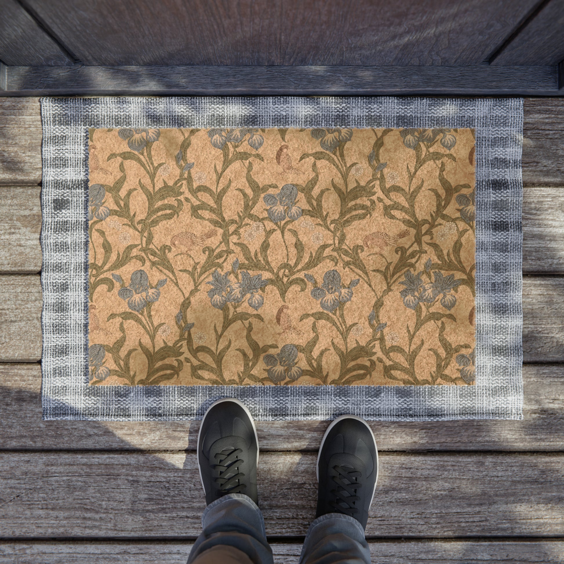 A rectangular coconut coir doormat with a floral pattern inspired by William Morris, featuring shades of blue, beige, and brown.