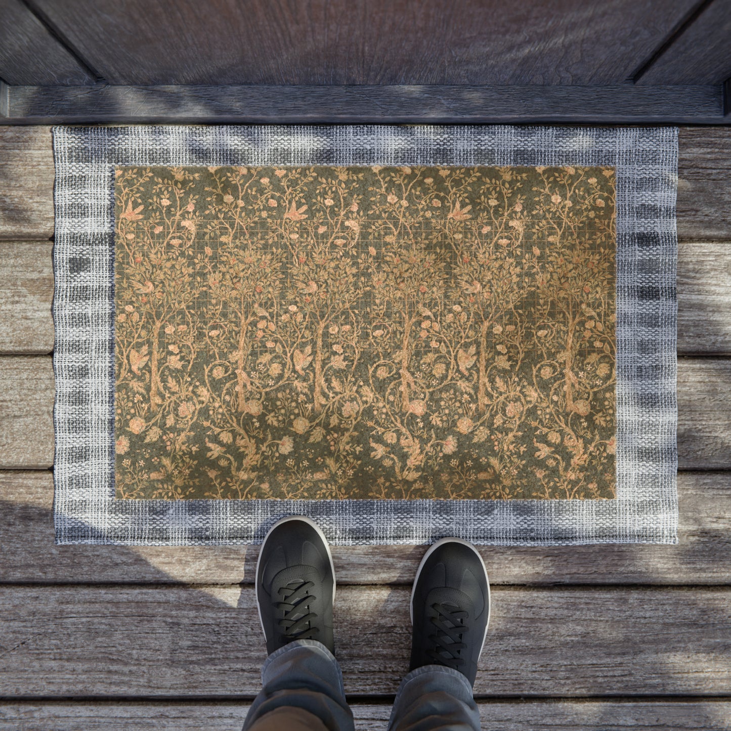 Rectangular coconut coir doormat with an intricate William Morris & Co floral pattern in a teal colour, featuring a black vinyl backing.