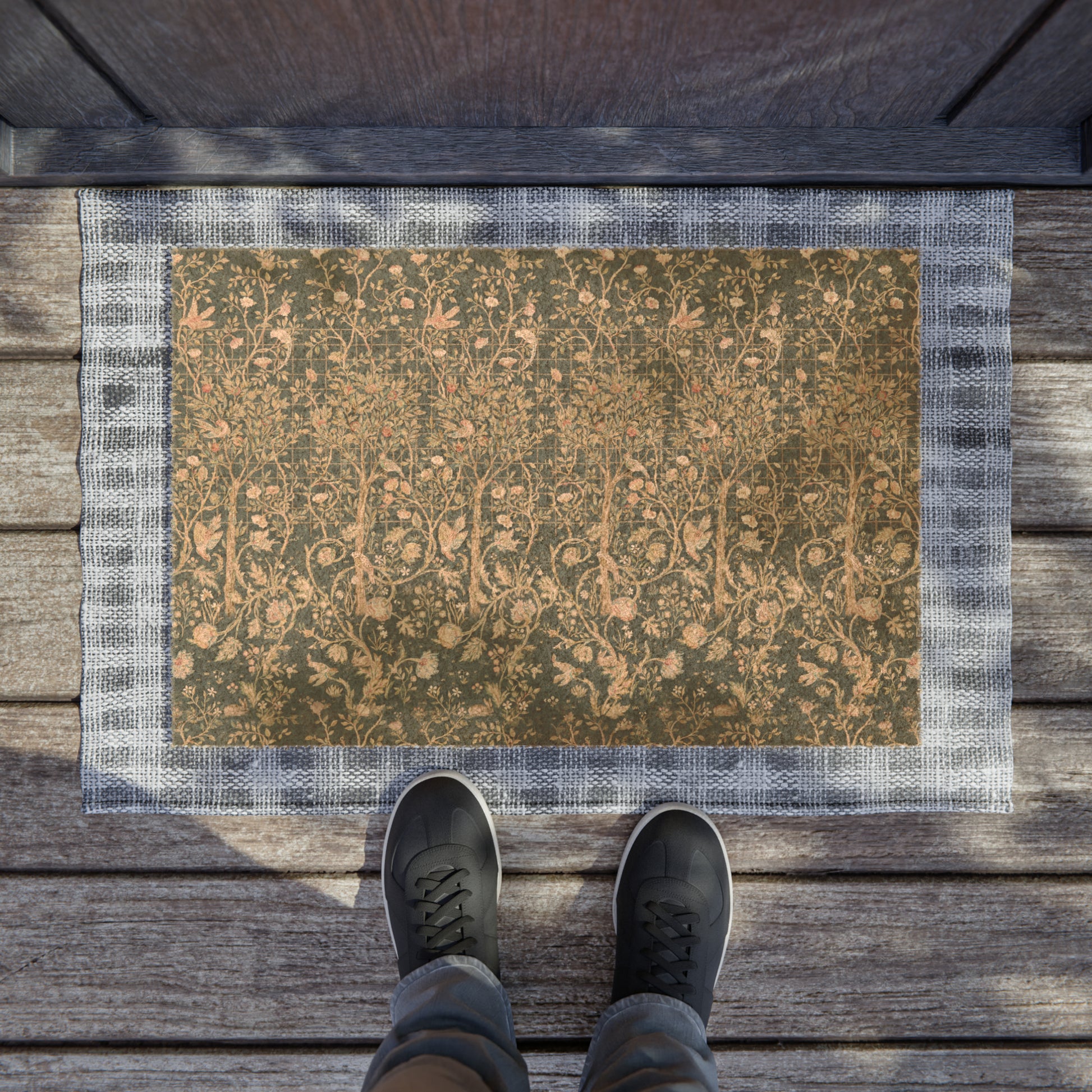 Rectangular coconut coir doormat with an intricate William Morris & Co floral pattern in a teal colour, featuring a black vinyl backing.