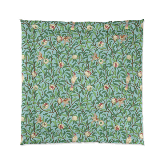 A quilt with a floral William Morris & Co pattern featuring birds and pomegranate fruits on a light Tiffany blue background.