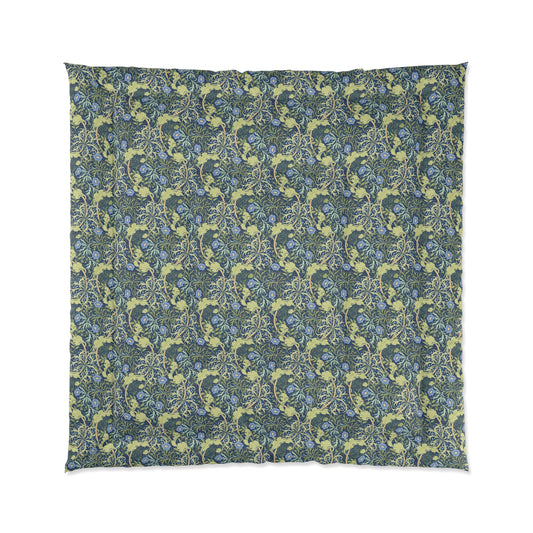 A folded comforter with a blue floral pattern inspired by William Morris's Seaweed Collection.