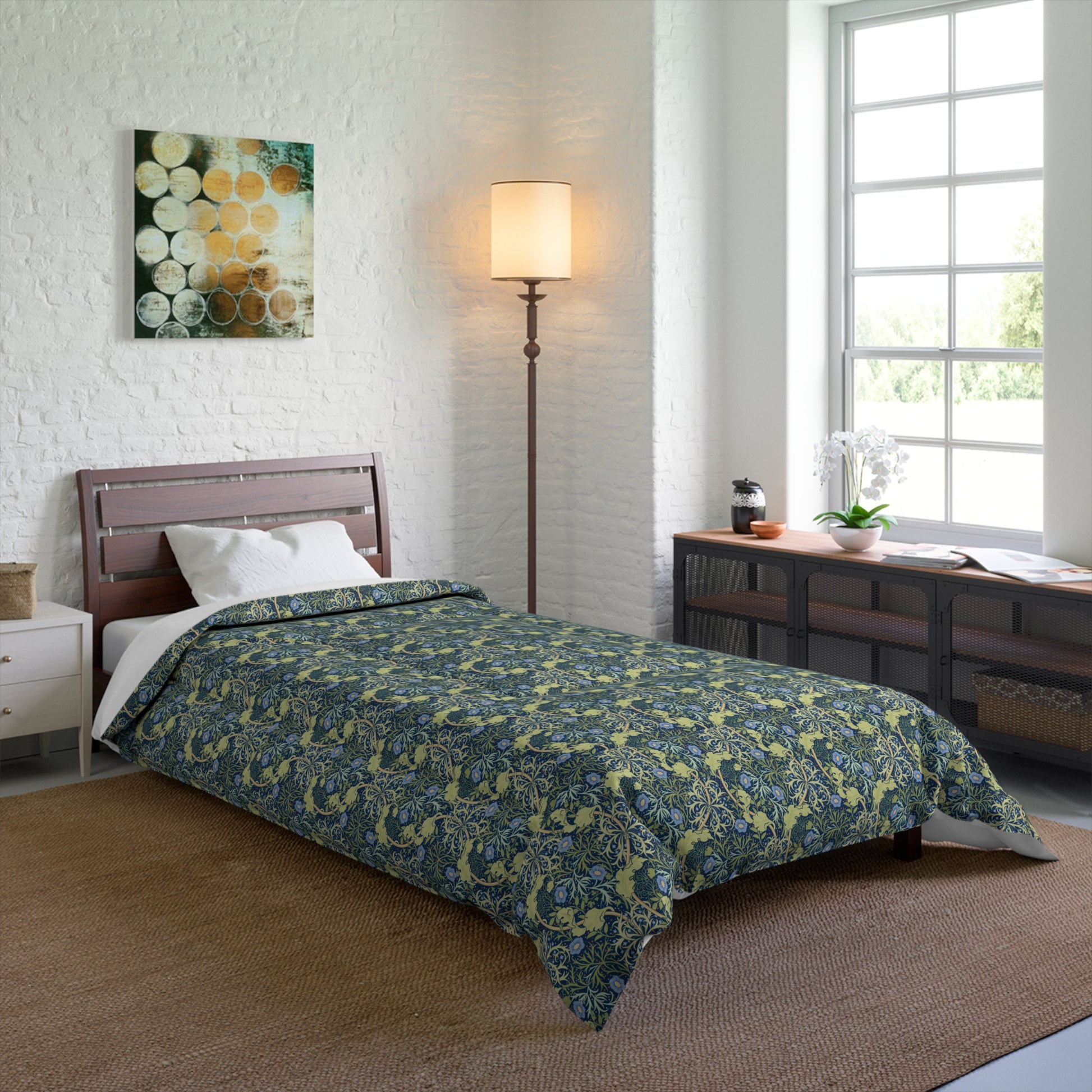 A folded comforter with a blue floral pattern inspired by William Morris's Seaweed Collection.