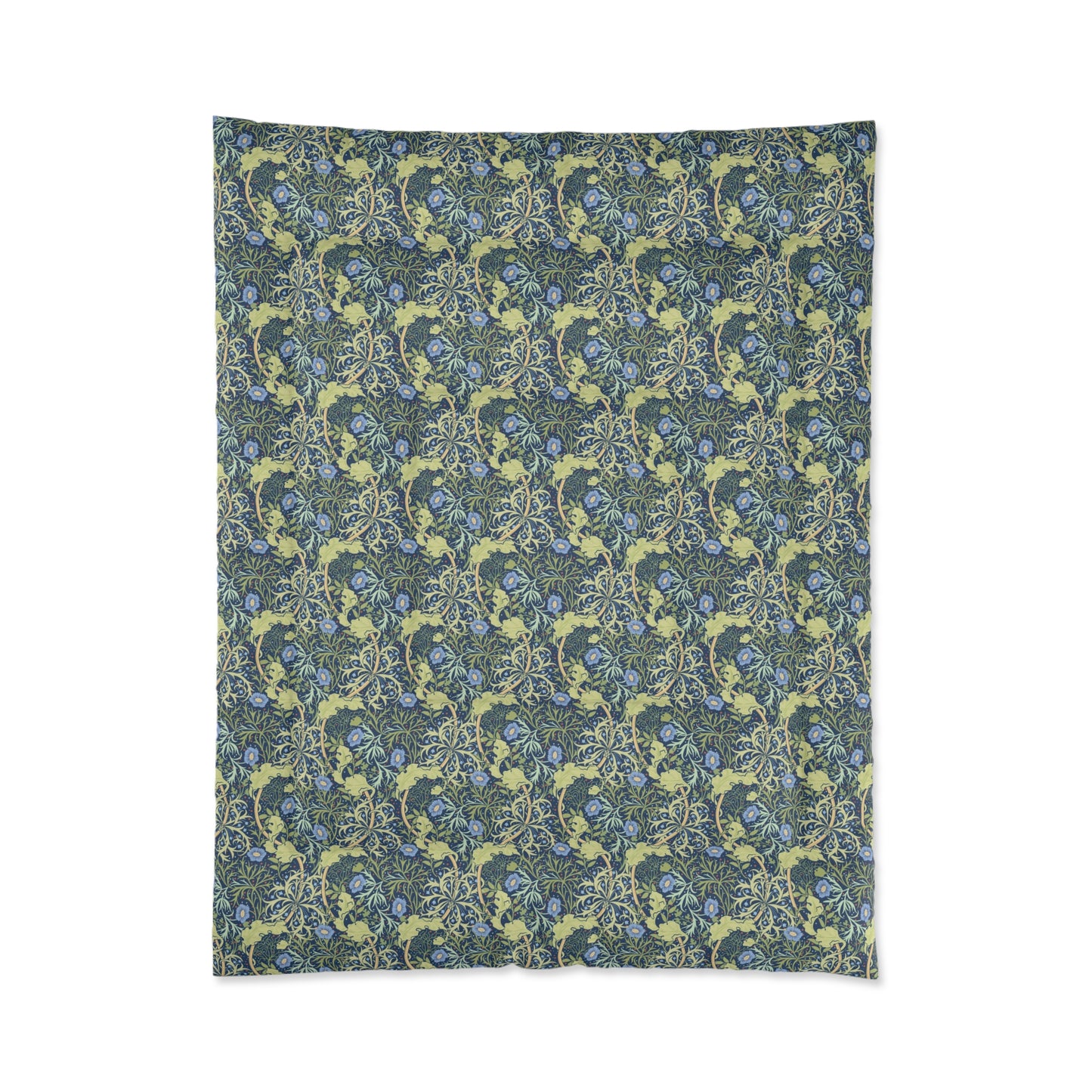 A folded comforter with a blue floral pattern inspired by William Morris's Seaweed Collection.