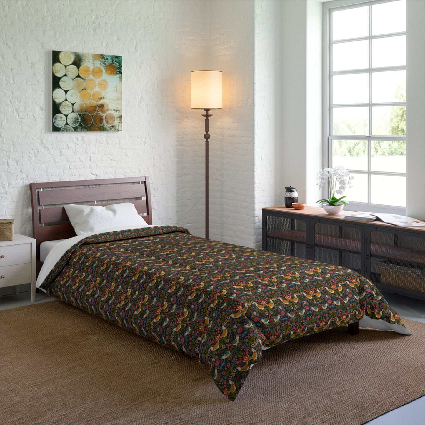Bedroom with floral-patterned comforter on a bed, lamp, and window.