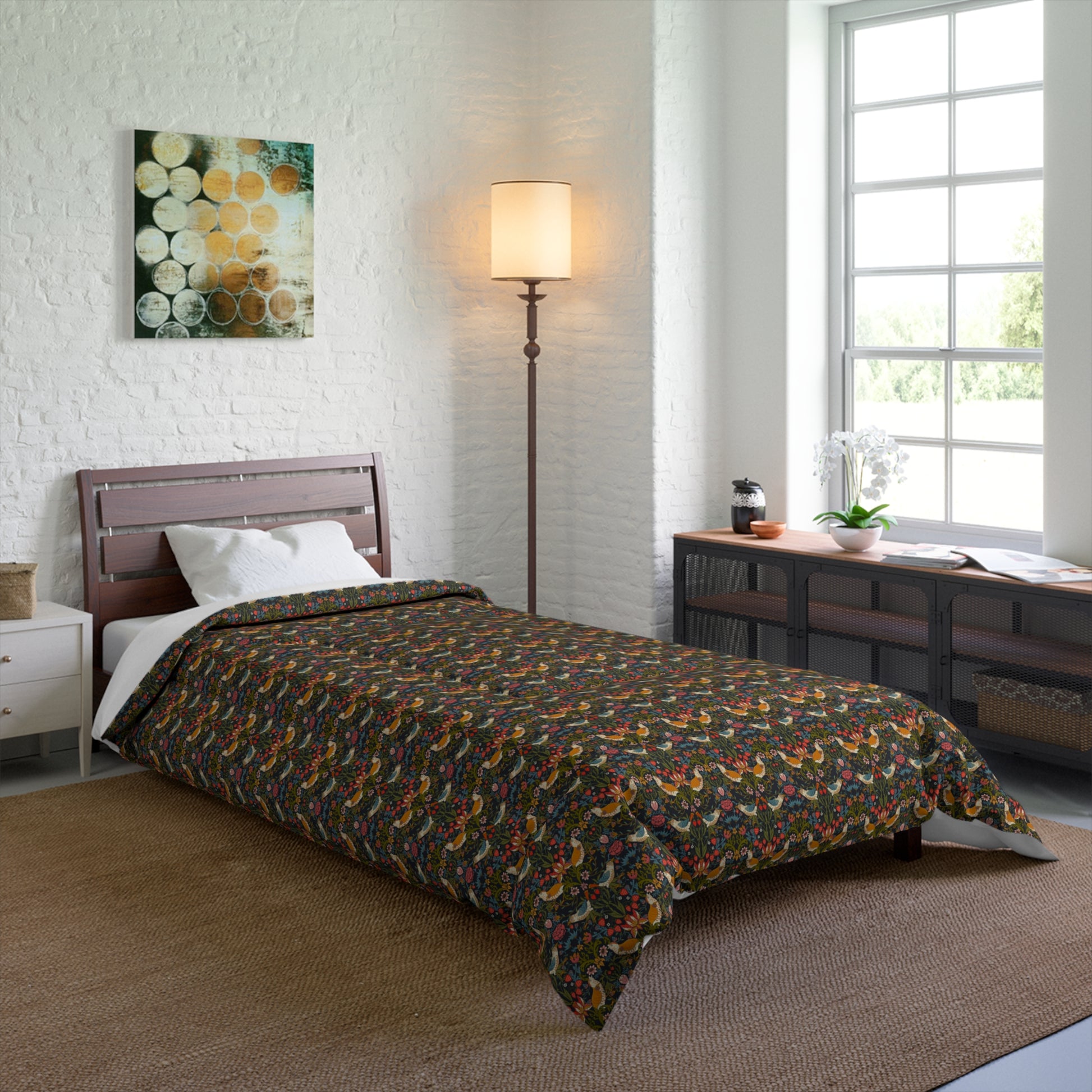Bedroom with floral-patterned comforter on a bed, lamp, and window.