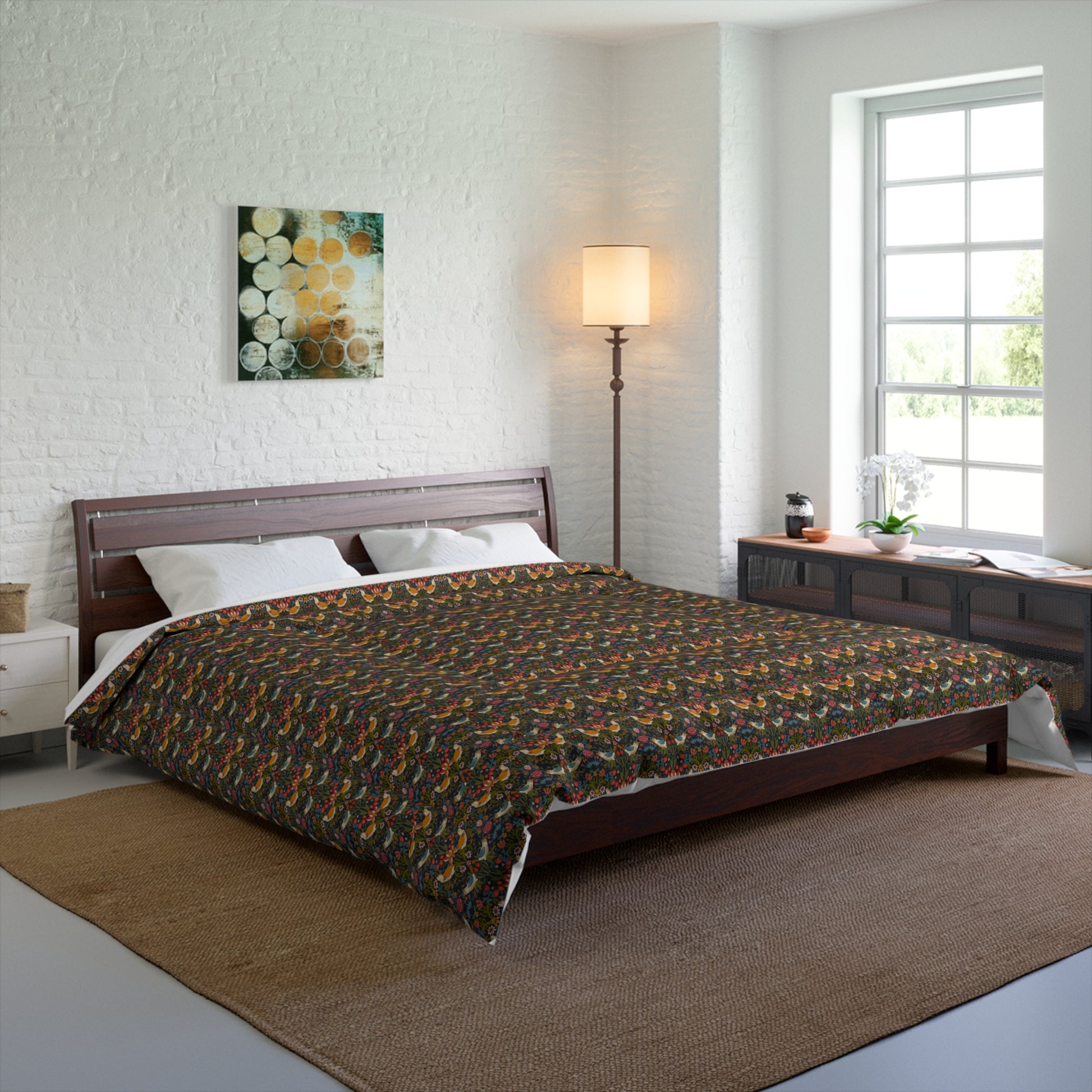 Bedroom with a bed covered in a patterned comforter, wooden headboard, and side tables.