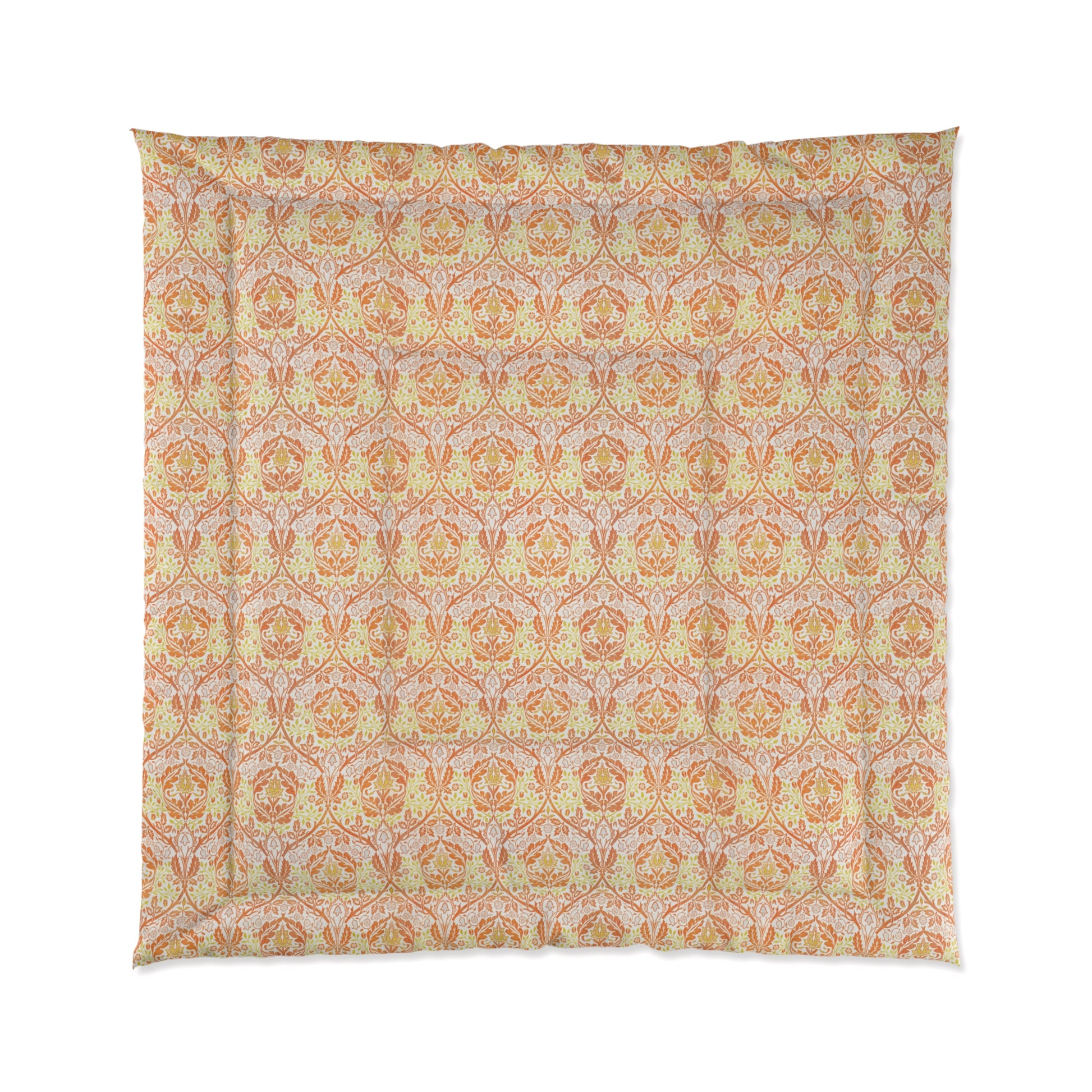 A comforter with a geometric William Morris & Co pattern called Golden Bough in shades of yellow, white, and orange.