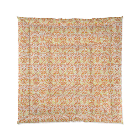 A comforter with a geometric William Morris & Co pattern called Golden Bough in shades of yellow, white, and orange.