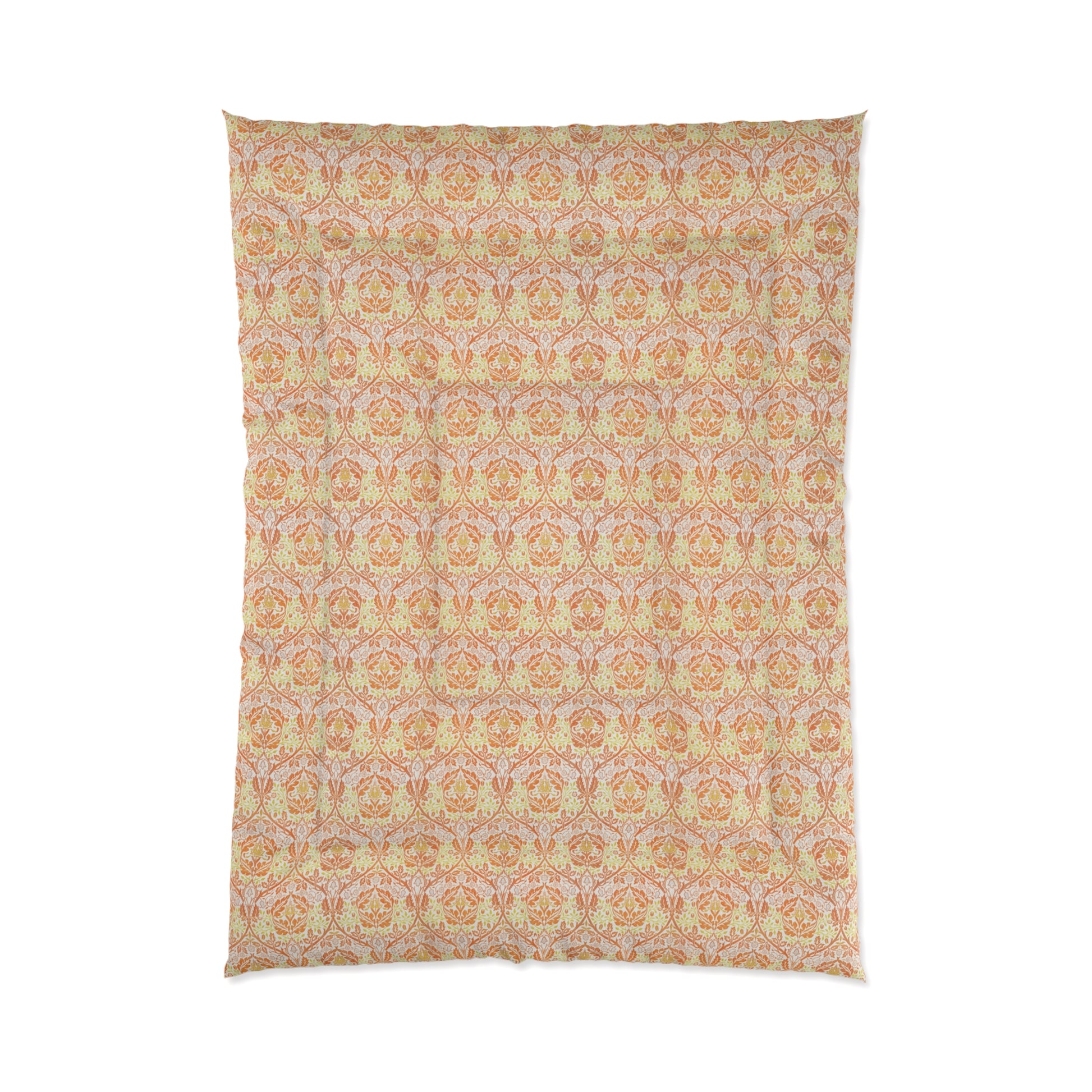 A comforter with a geometric William Morris & Co pattern called Golden Bough in shades of yellow, white, and orange.