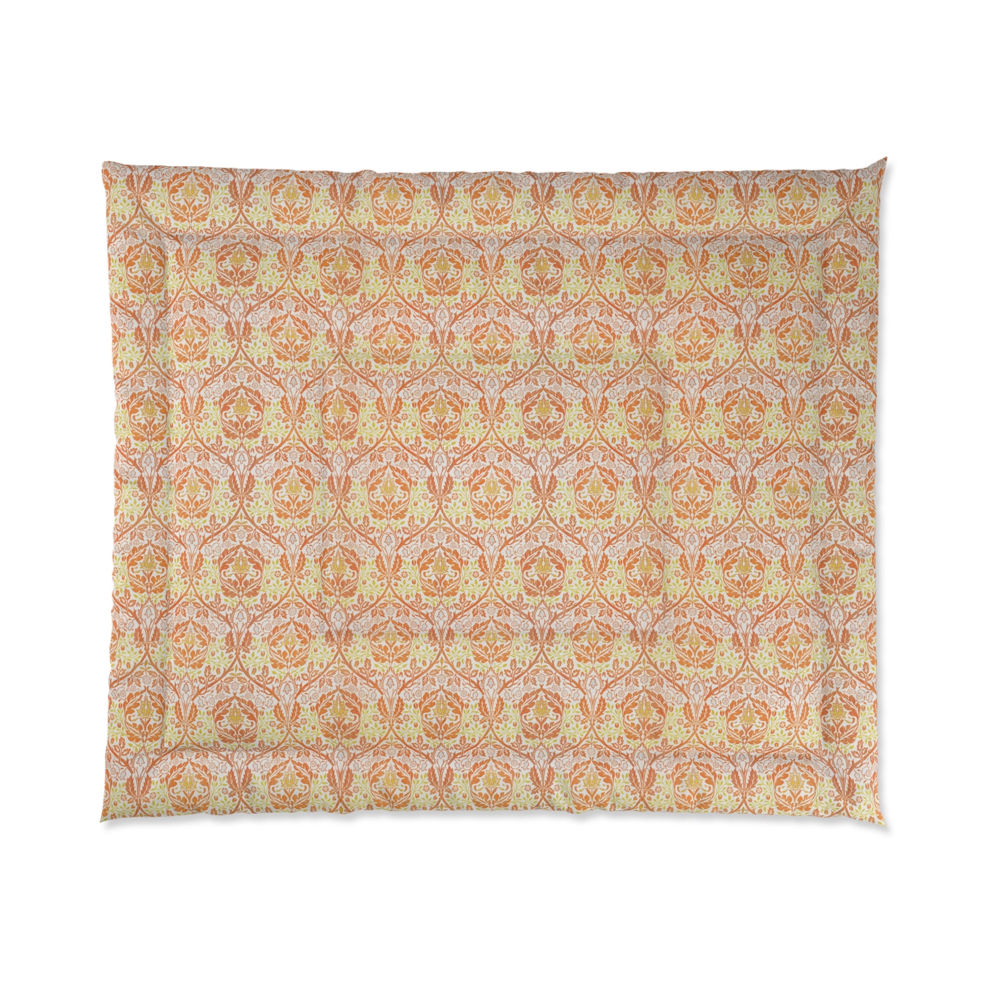 A comforter with a geometric William Morris & Co pattern called Golden Bough in shades of yellow, white, and orange.