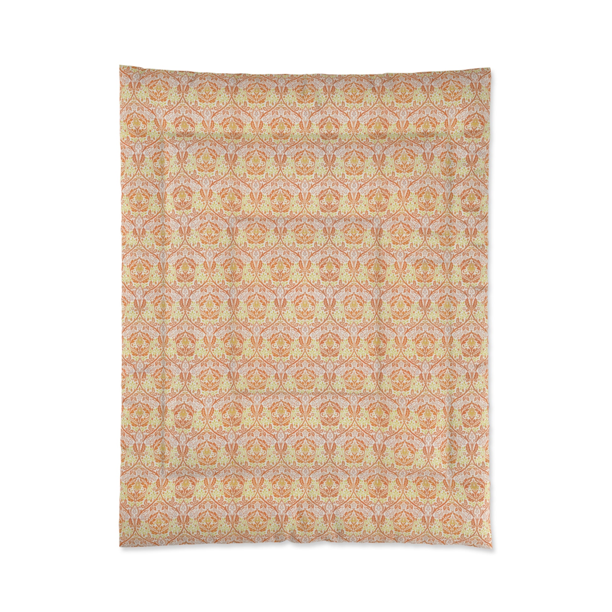 A comforter with a geometric William Morris & Co pattern called Golden Bough in shades of yellow, white, and orange.